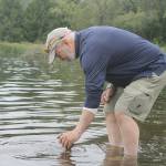 Record file  Clyde Jenkins of the South Whidbey Yacht Club collected water samples from Lone Lake in July. Efforts to monitor the lakes water quality have been community-driven.