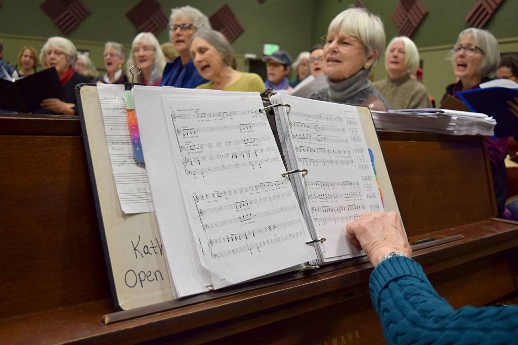 Kyle Jensen / The Record  Accompanist Kathy Fox turns the page during a rehearsal this past Monday evening.