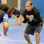 Evan Thompson / The Record  First-year head coach Robbie Bozin teaches technique at a recent South Whidbey wrestling practice.