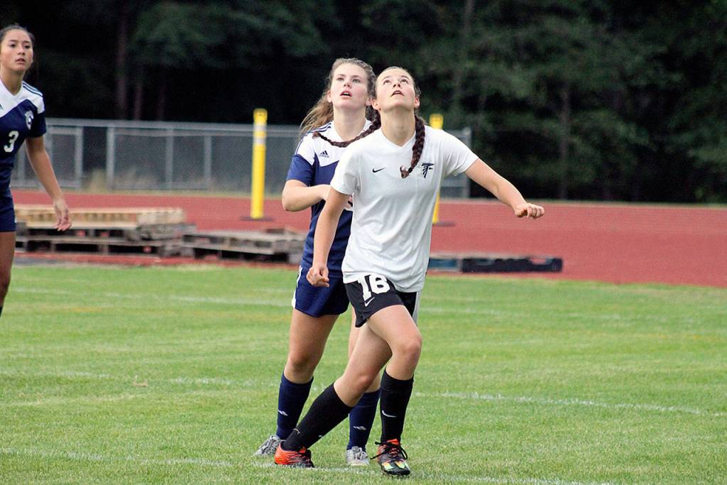 Evan Thompson / The Record  South Whidbey sophomore Alison Papritz tracks a ball in the air during a match against Sultan in September. Head-to-head contact was the catalyst for two concussions suffered by girls soccer players this fall.
