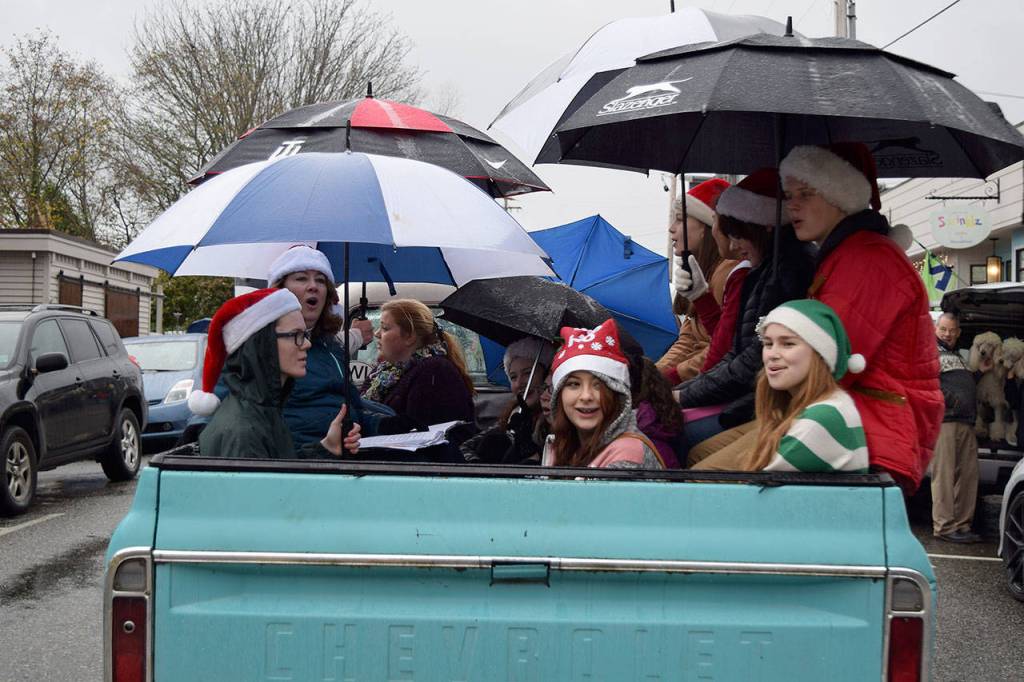 Kyle Jensen / The Record  A group of people young and old sang Silent Night from a truck bed.