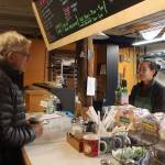 Greenbank store and deli employee Emily Terao answers questions about the impending sale of Greenbank Store and Grille. Terao and her husband, Alex Pulichino, are planning to buy the historic structure, close it for a few months for repairs and then re-open the restaurant and store in the spring.                                Photo by Patricia Guthrie/Whidbey News-Times
