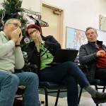 Kyle Jensen / The Record  Scott Martin (left) and class organizer Mel Watson (center) pretend to play the harmonica while John Raabe (right) sings.