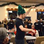 Darren McCoy, choir teacher at Oak Harbor High School, directs his students in a performance at Family Bible Church Friday morning. McCoy has been named as one of 1o finalists for the Grammy Music Educator Award. Photo by Laura Guido/Whidbey News-Times
