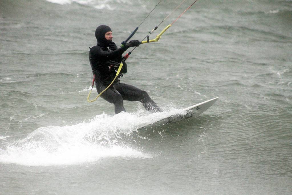 Evan Thompson / The Record  Steve Boyle charges across Useless Bay during a windy day on Dec. 28.