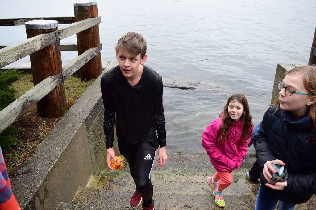 Kyle Jensen / The Record  A brave soul took a dip to grab the lone sea float in Saratoga Passage. Organizers didnt plan to hide any in the water, but the wind pushed it off a park ledge.