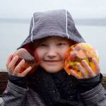 Kyle Jensen / The Record  Olive Stieber, a 7-year-old Seattle resident, shows off her finds at the Sea Float Scramble. She says she picked a second up for her dad, who couldnt attend.