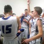 Evan Thompson / The Record  South Whidbeys boys basketball team celebrates in the locker room following its 65-50 victory over Kings on Tuesday night.