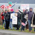 Evan Thompson / The Record  Protestors gathered along the sidewalk of Cascade Avenue in Langley to protest President Donald Trump on Saturday, a year after his inauguration.