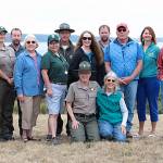 Rangers and staff of Whidbeys seven state parks pose with the founding members of Friends of Whidbey State Park. In the front row kneelinng is park naturalist Janet Hall (left) and lead Friends organizer Margie Parker. Photo provided