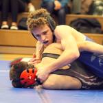 South Whidbey senior  Micah Tarantino attempts to pin Cedarcrests Curtis Nelson at the Falcons senior night match on Jan. 25 at Erickson Gymnasium.