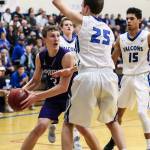 Steve Smith photo  South Whidbey sophomore Levi Buck defends Nooksack Valleys Jordan Veening. Veening, a 6-foot-6 senior forward, was one of the Pioneers most physical players.