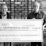 Contributed photo                                Walt Blackford (left), Puget Sound Energy regional outreach manager, presented a grant of $4,565 from the Puget Sound Energy Foundation to John Acton of the Island County Amateur Radio Club (ICARC).