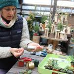 Tobey Nelson glues tiny pieces of a succulent plant on a bundle on wire to create botanical jewelry. Nelson specializes in floral arrangements for special occasions and she teaches floral jewelry classes. Photo by Patricia Guthrie/Whidbey News-Times