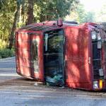Evan Thompson / The Record  There was about one to two inches of snow accumulation on Feb. 21-22. Though not all areas of South Whidbey had visible snow late in the afternoon on Thursday, ice was still a problem. Rusty Floyd rolled his 1990 Jeep Cherokee when his vehicle slid on on an icy patch next to the orange cone in the background. Floyd, a 37-year-old Clinton resident, was uninjured.