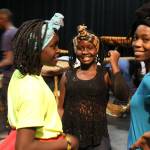 Members of Dance of Hope from Uganda take a break from rehearsing on the stage of South Whidbey High School where theyll present a public performance Friday evening. Photos by Patricia Guthrie/Whidbey News-Group