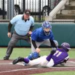 Dexter Jokinen puts the tag on an Oak Harbor runner in the Anacortes Jamboree last week.(Photo by John Fisken)
