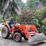 Photos by Patricia Guthrie/Whidbey News-Times                                Many changes took root at Meerkerk Gardens this winter, including a new configuration of strolling paths. Frank Simpson, executive director and garden manager, brings in another layer of crushed rock to rack.