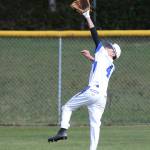 Alex Black races back on a fly ball in Saturdays game with Coupeville. (Photo by John Fisken)