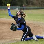 South Whidbey second baseman Myah Majestic throws to first from her knees after making a stop. (Photo by John Fisken)