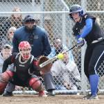 Lexi Starets-Foote puts the ball in play before it reaches Coupeville catcher Sarah Wright.(Photo by John Fisken)