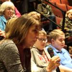 Irene Hughes poses a question to the panel of students and community leaders addressing school security. About 100 people attended the Langley event, including parents, students, former students and educators.