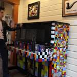 Artist Gina Michel with the 1923 Gulbransen Player Piano she rescued in California and covered with more than 1,500 tiles that she hand makes in her studio. Photos by Patricia Guthrie/Whidbey News-Group