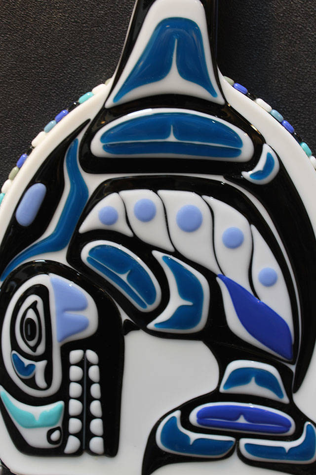 This piece, called Nanooks Orca Guitar, is comprised entirely of fused glass Gina Michel cut and layered to give it a three-dimensional look.