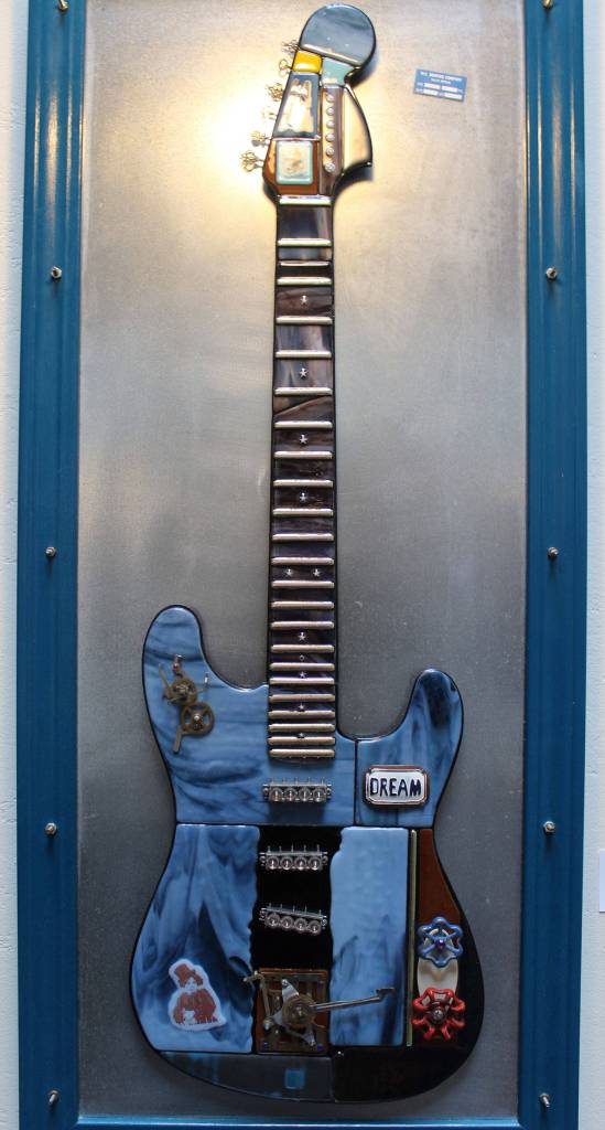 Gina Michel put this guitar up for auction and bids are still being taken; all the proceeds benefit WAIF.