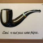 In some of her work, Gina Michel takes famous art images and captures them in fused glass. This one is Magrittes This is not a Pipe.