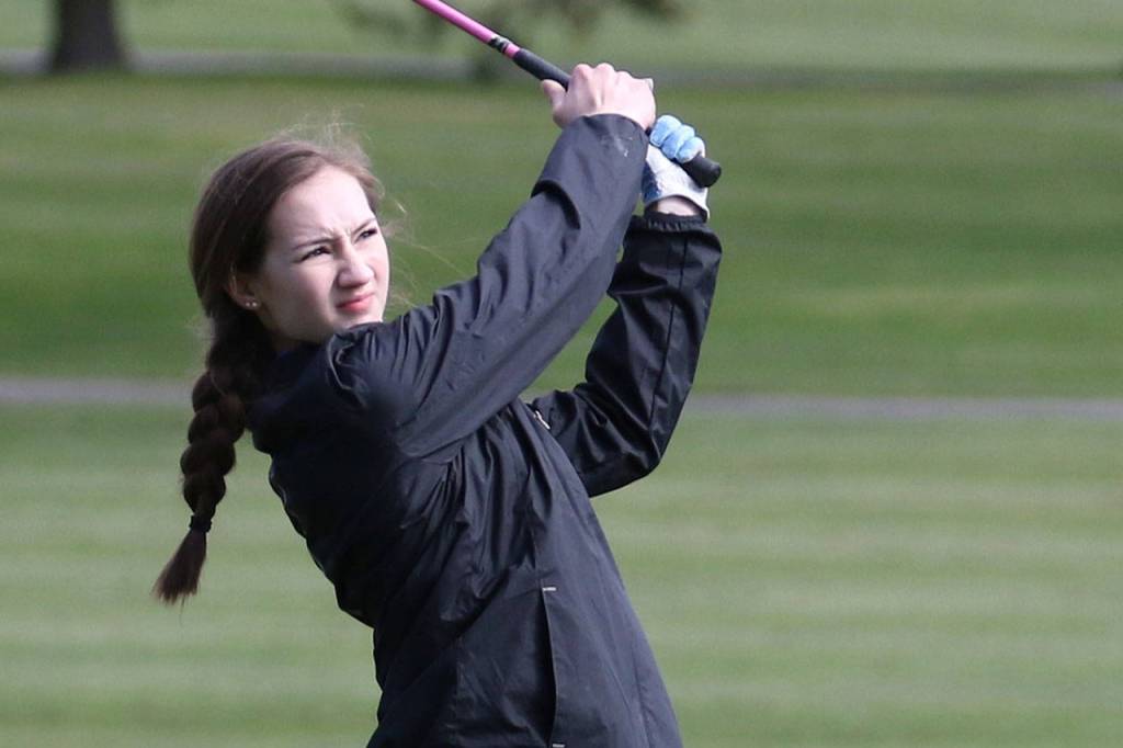 Alyssa Ludtke follows her shot during Tuesdays tournament in Oak Harbor.(Photo by John Fisken)