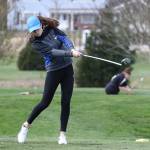 Tori Schuller tees off Tuesday in Oak Harbor.(Photo by John Fisken)