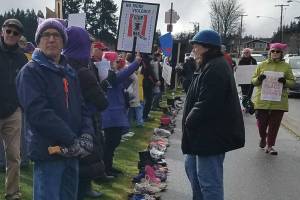 Empty shoes for kids gone to guns