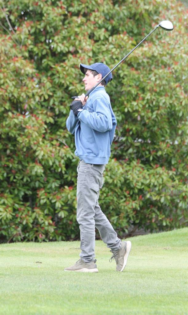 Soren Bratrude sizes up his opening drive Monday. (Photo by Jim Waller/Whidbey News Group)