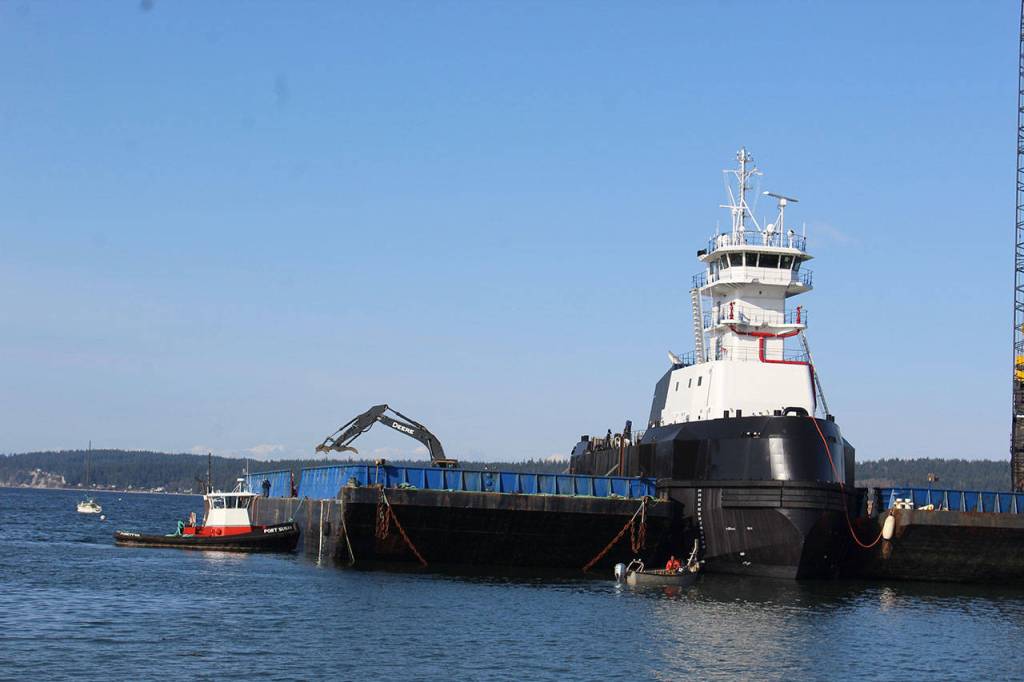 Big tug, little tug. In the wee hours of Easter Sunday, the articulated tug with no name successfully motored to Nichols Brothers dock in Langley.