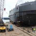 Crawlers placed under the vessel slowly roll it forward to the shore. Frank Nichols, founder of the company, invented the crawlers, his son, Matt Nichols said.