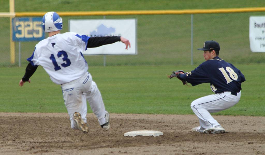 Drew Fry steals second base as the Eagles Quincy Yoshida awaits the throw.(Photo by Jim Waller/Whidbey News Group)