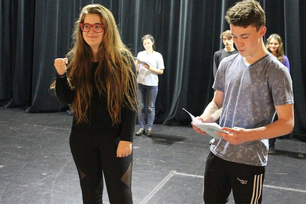 Actors quickly change roles, including for this scene from Shakespeares most famous romantic tale, Romeo and Juliet. Fiona Roberts practices her role of Juliet with her Romeo, Caleb McArthur. The production, Just Another High School Play, opens April 12.