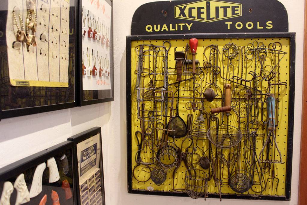 Found Objects includes the items and advertising cards of old tools, salt and pepper shakers, pens, cigarette lighters, watches, magnets, fuses, nail files, key chains and assorted other flotsam of yesteryear.