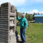 Hank Nelson stands near one of his 8-foot granite sculptures, one of hundreds within Cloudstone Sculpture Park.