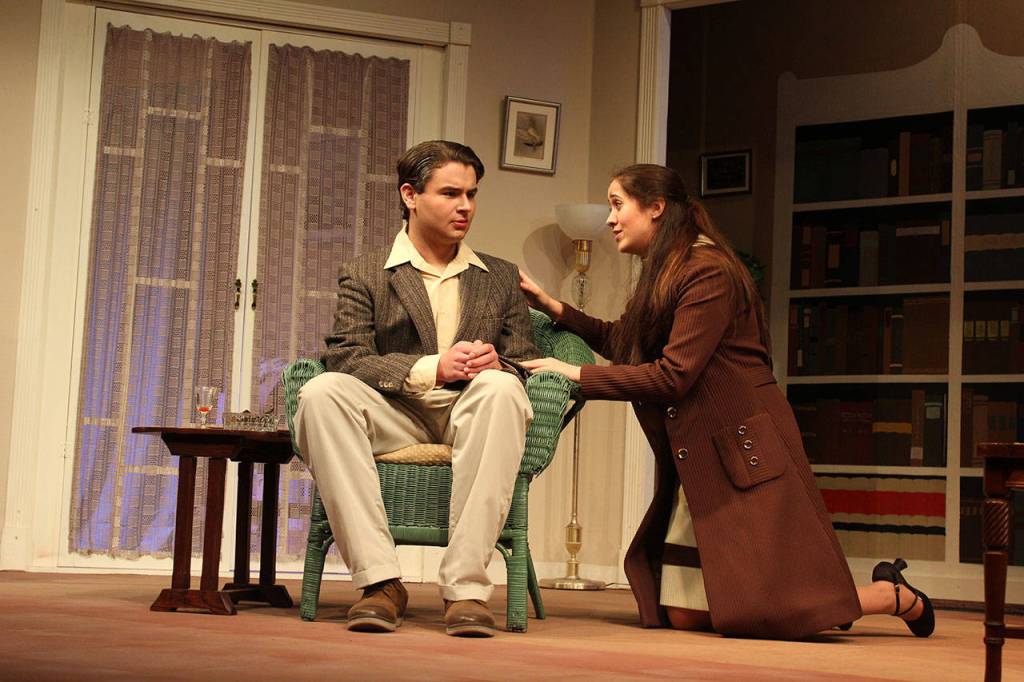 Is it an unconventional marriage proposal? Or perhaps something else causes Trinity Slowik (Midge Harvey) to kneel beside Warren Rogers (Edward Angkatell) near the end of the play, The Hollow, at Whidbey Playhouse April 13-29.