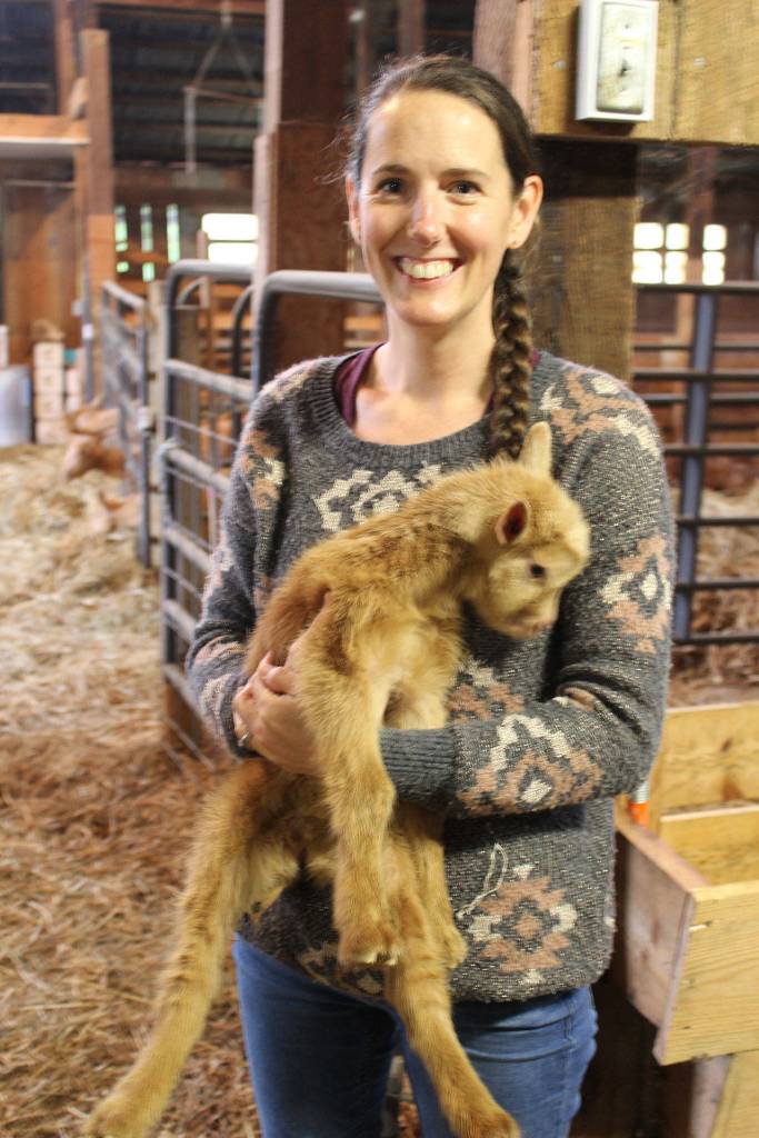 Kimberly Christensen with one of North Whidbey Farms many kid goats. She started making soap a few years ago.