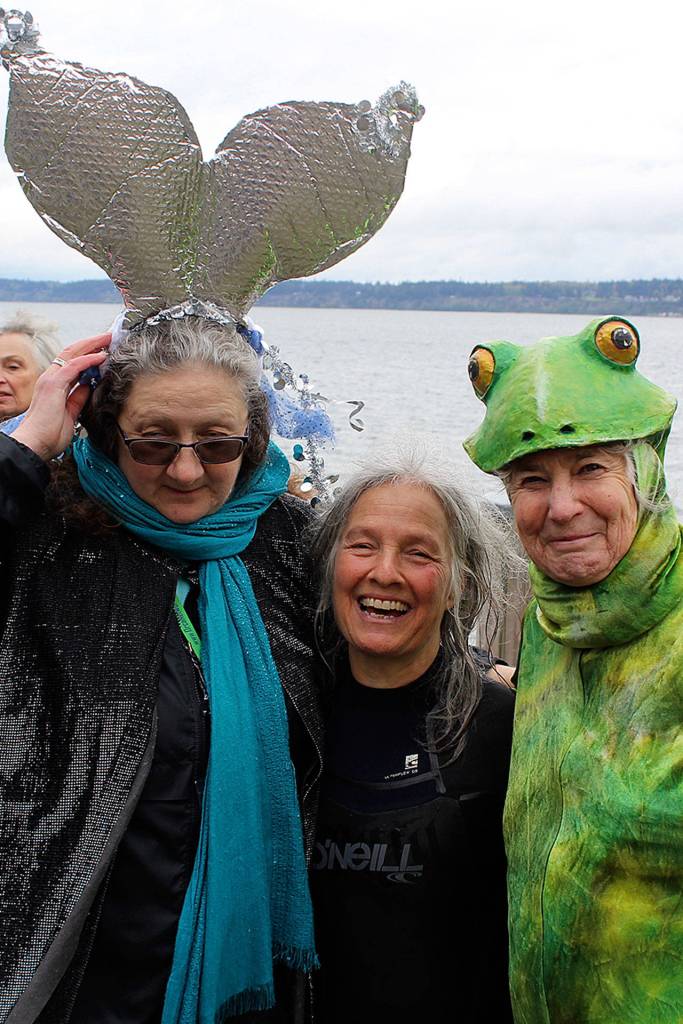 Three South Whidbey women who sparked the idea for a whale parade 15 years ago are Susan Berta of Orca Network (flukes) artist Deborah Koff-Chapin (center in wet suit) and playwright Gail Fleming (frog).