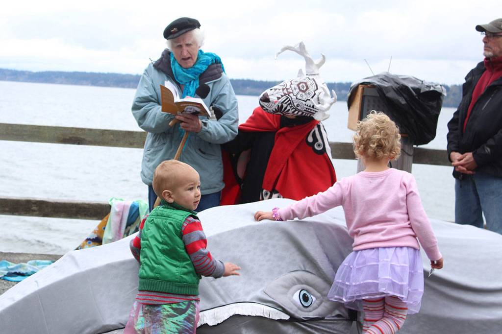 As Peter Lawlor, South Whidbeys poet laureate, reads one of his poems dedicated to the visiting whales, lots of little ones wanted to pet Patch the Parade Whale.