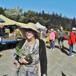 A happy customer leaves the 2017 plant sale of South Whidbey Garden Club. On April 28, the clubs annual sale will be indoors for the first time at Bayview Community Hall. Photo provided