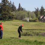 Marsha Coolidge looks on as Nancy Lawless concentrates on her next shot. The Womens Golf Club of Holmes Harbor meets every Thursday at 9 a.m. to play 18 holes.
