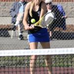 Ainsley Nelson shoots a backhand in second doubles match Wednesday.(Photo by John Fisken)