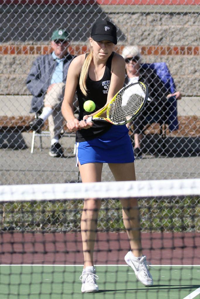 Ainsley Nelson shoots a backhand in second doubles match Wednesday.(Photo by John Fisken)