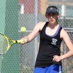 Ashley Ricketts volleys during the second singles match.(Photo by John Fisken)