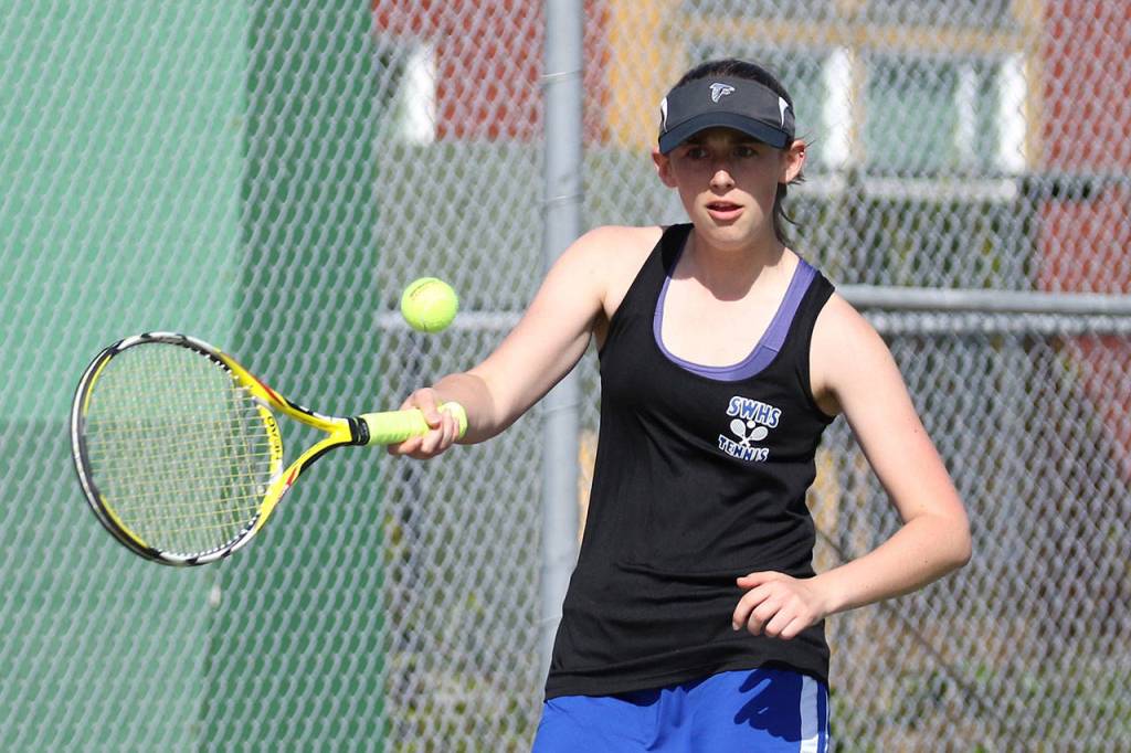 Ashley Ricketts volleys during the second singles match.(Photo by John Fisken)